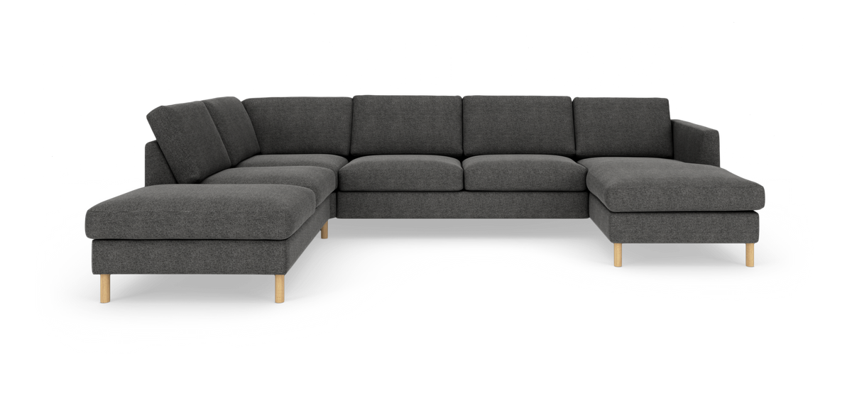 Mørkegrå modulsofa i U‑form med træben, fotograferet på hvid baggrund.
