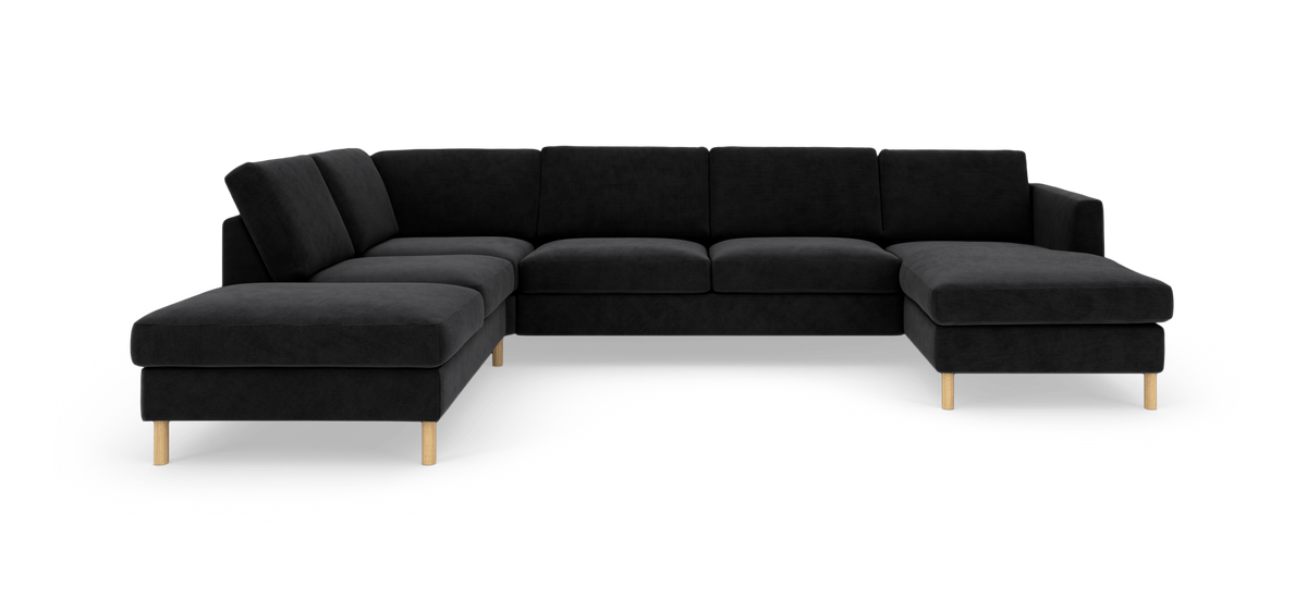 Sort L‑formet modulsofa med træben, fritlagt på hvid baggrund.