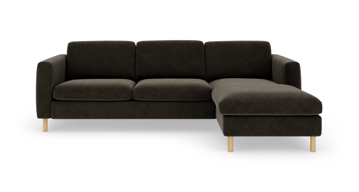 Mørkegrå modulsofa med højrevendt chaiselong og træben, frilagt på hvid baggrund.