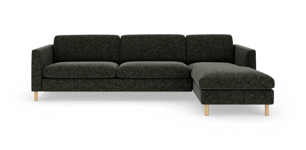 Mørkegrå hjørnesofa med højre chaiselong og runde træben, frilagt på hvid baggrund.