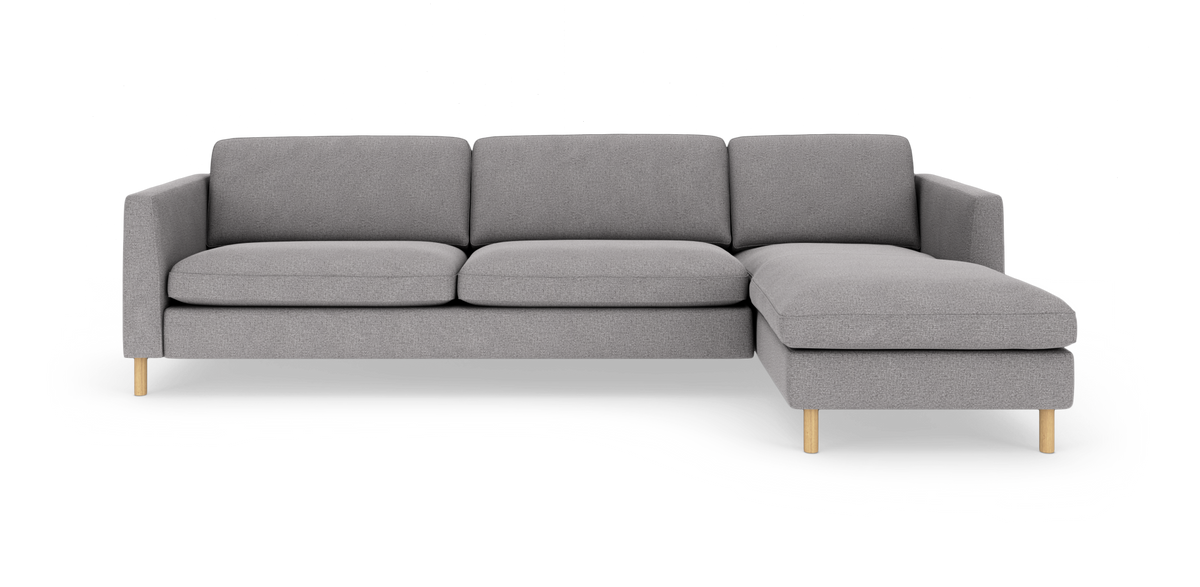 Grå modulsofa med chaiselong til højre på hvid baggrund.