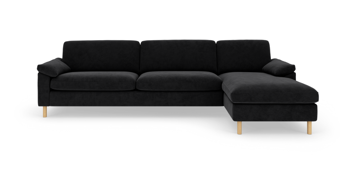 Sort modulsofa med højre chaiselong, fritstående på hvid baggrund.