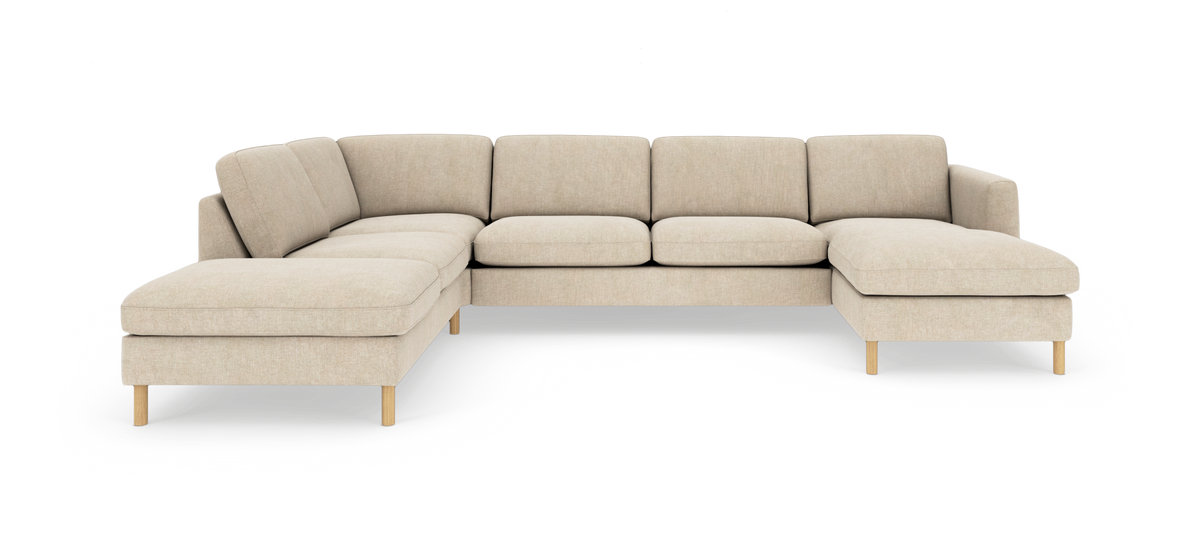 Beige U-formet modulsofa med træben, set forfra mod hvid baggrund.