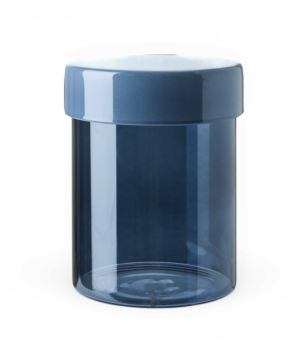 Transparent blå opbevaringskrukke med matchende låg, frilagt.