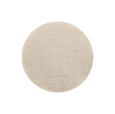 Beige rundt tæppe med subtil meleret, tekstureret overflade.