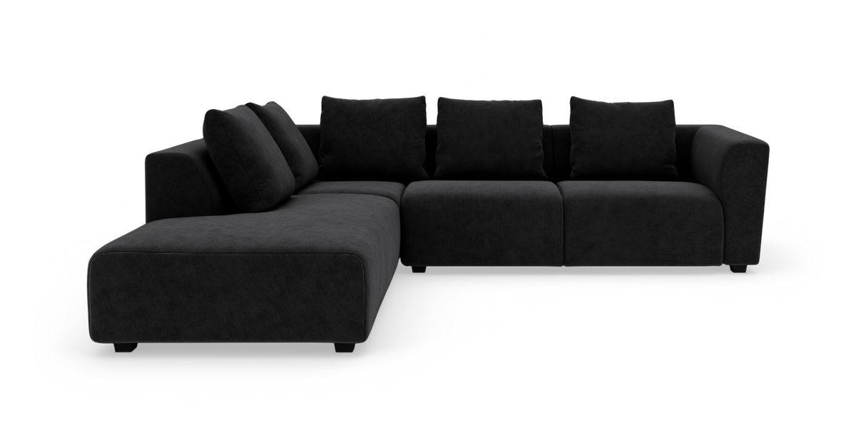 Sort modulsofa med chaiselong i frontvinklet visning på hvid baggrund.