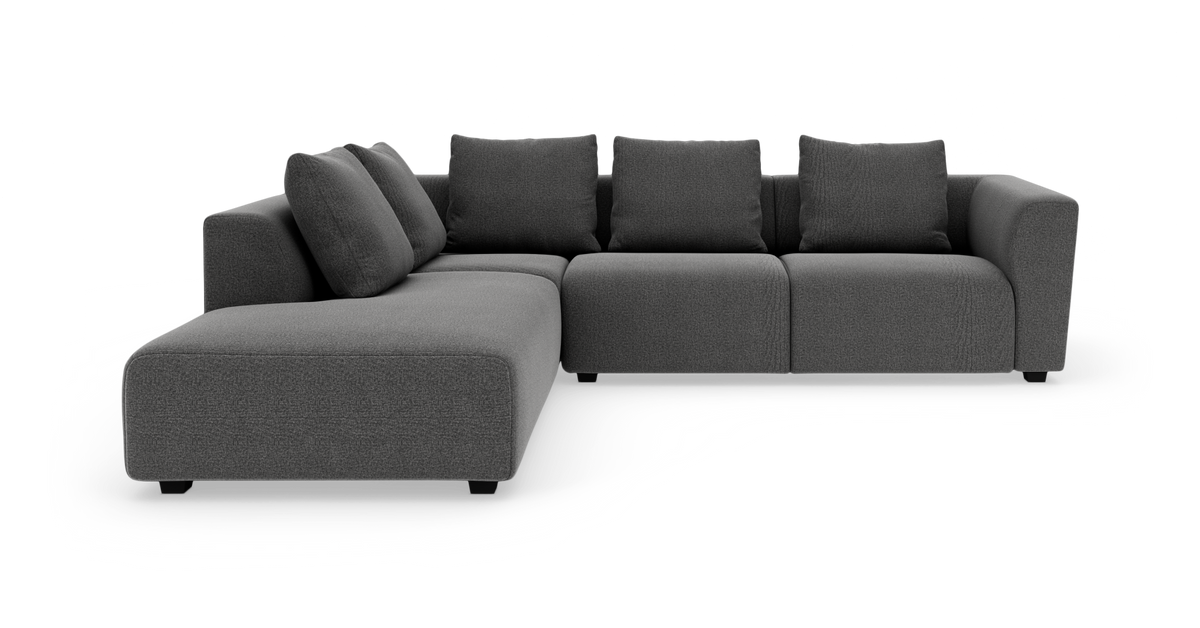 Mørkegrå modulhjørnesofa med chaiselong og ryghynder på hvid baggrund.