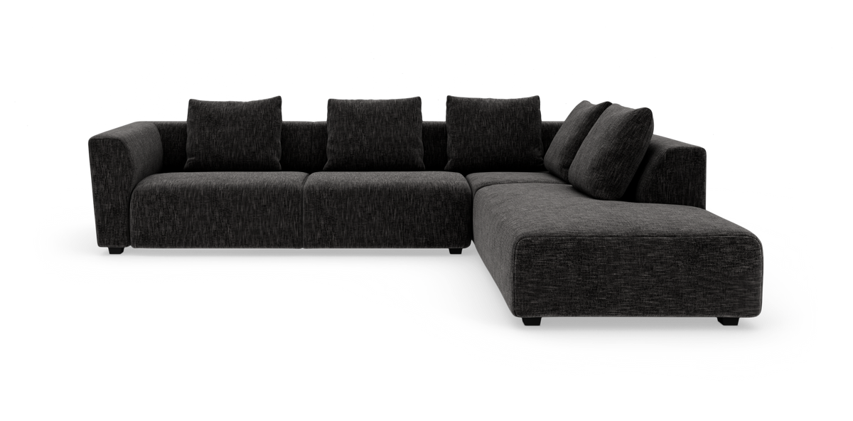 Mørkegrå L‑sofa med chaiselong til højre, fritstående på hvid baggrund.