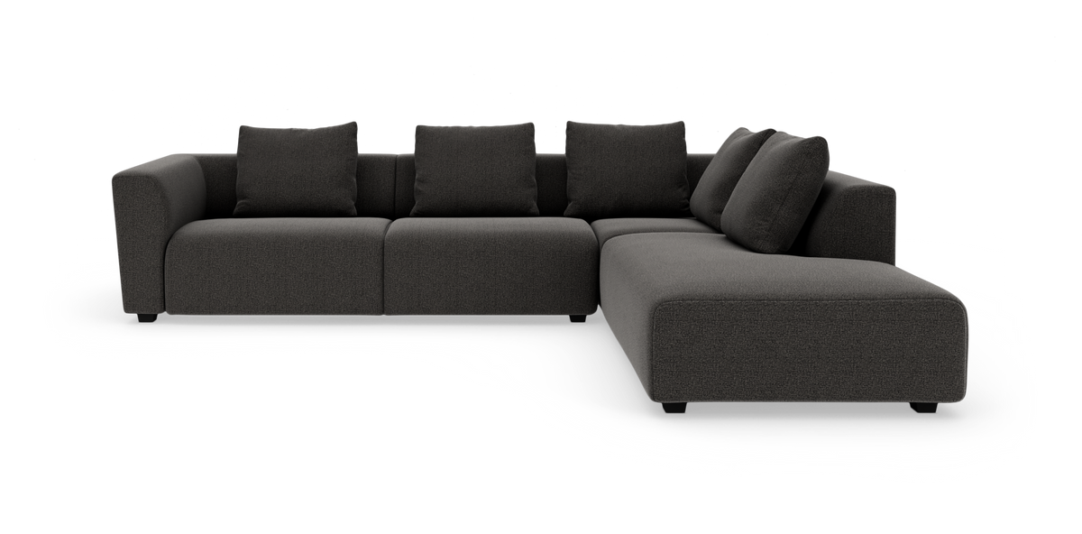 Mørkegrå modulopbygget L‑sofa med fem ryghynder og chaiselong til højre, frilagt på hvid baggrund.