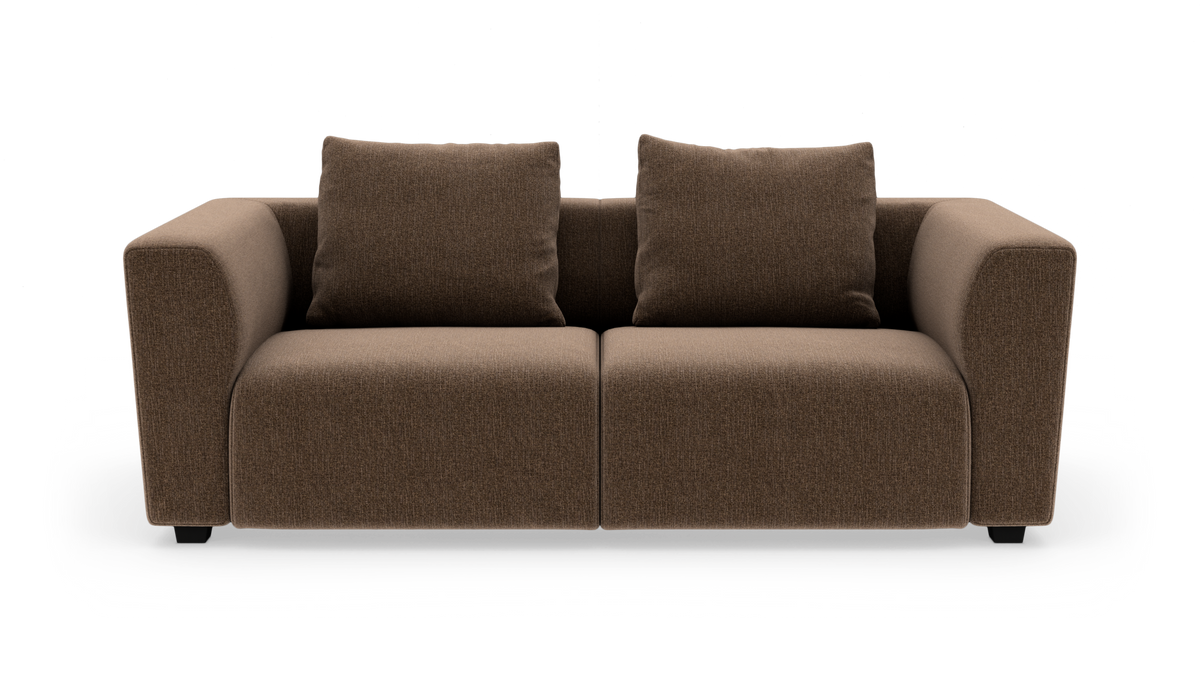 Brun to-personers sofa med to ryghynder i studiemiljø.