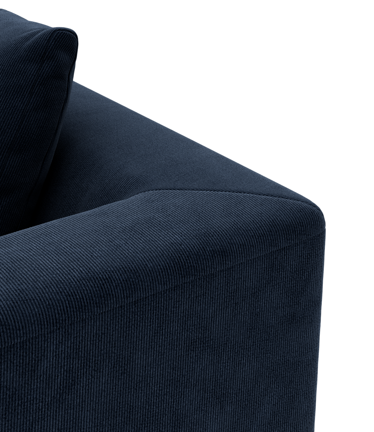 Nærbillede af et mørkeblåt sofa-hjørne i bredriflet fløjl med matchende rygpude.