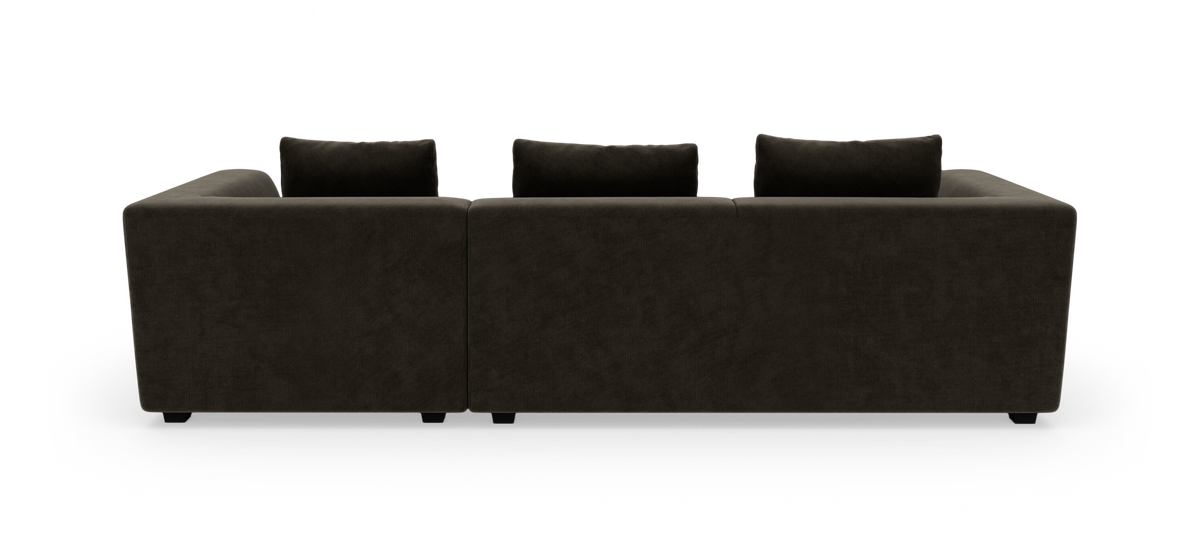 Mørkebrun modulsofa set bagfra på hvid baggrund.