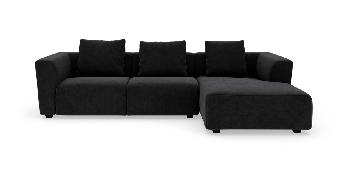 Mørkegrå/sort 3-personers modulsofa med chaiselong til højre og tre ryghynder, set lige forfra.