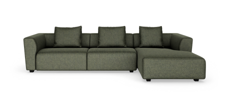 Grøn modulopbygget hjørnesofa med chaiselong til højre og fire puder på hvid baggrund.