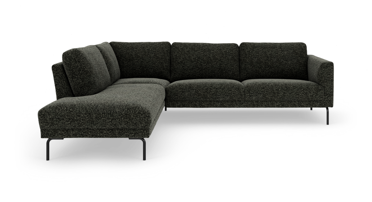Mørkegrøn L-formet modulsofa med chaiselong til venstre og slanke metalben.