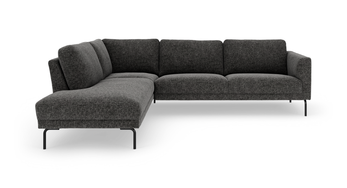 Mørkegrå L-formet modulsofa med chaiselong til venstre og slanke metalben.