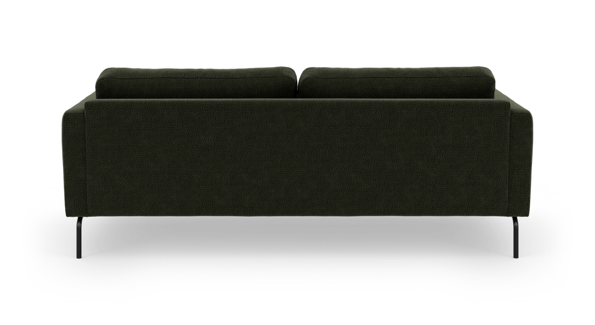 Mørkegrøn sofa set bagfra på hvid baggrund med slanke sorte ben.