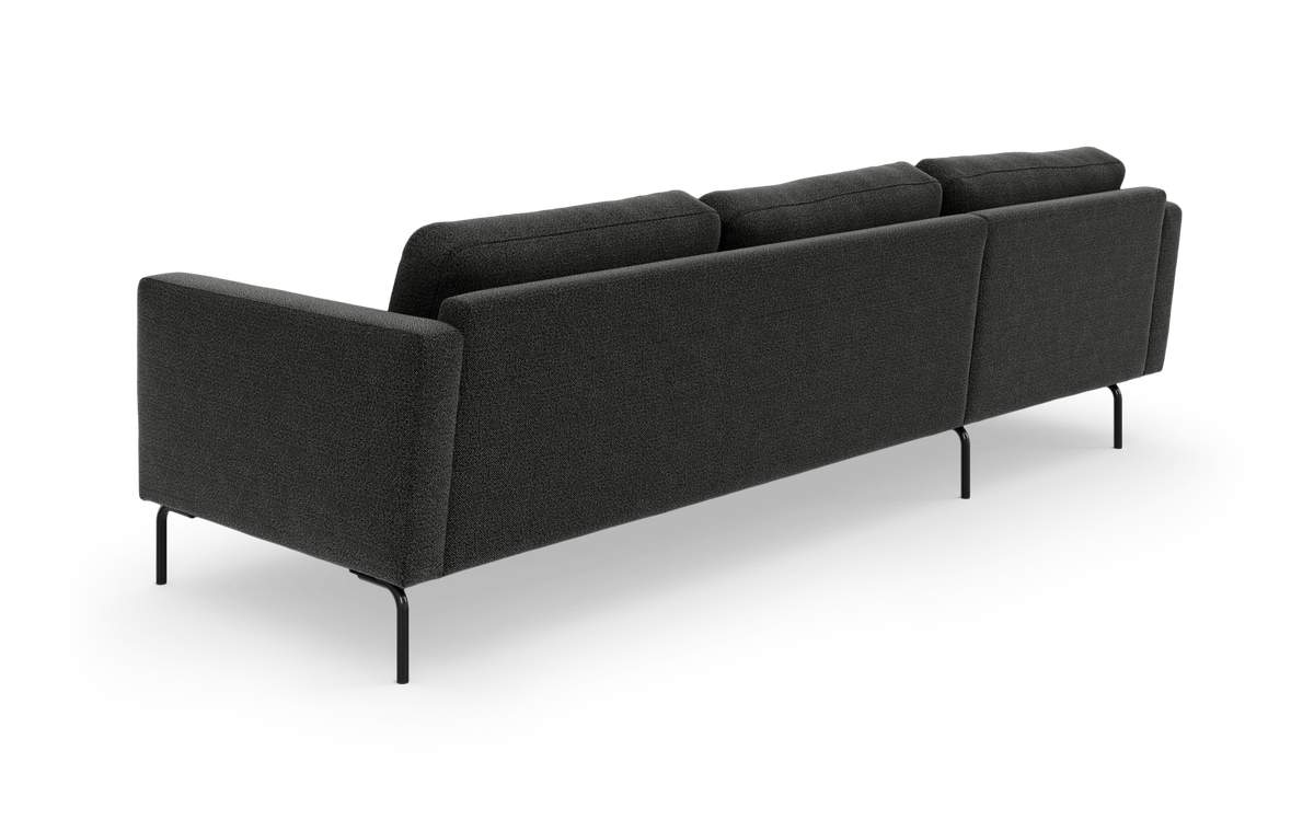 Mørkegrå sofa set bagfra på hvid baggrund, med slanke sorte ben.