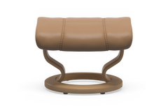 Beige læderfodskammel med rund træbase og blød polstring i moderne design.