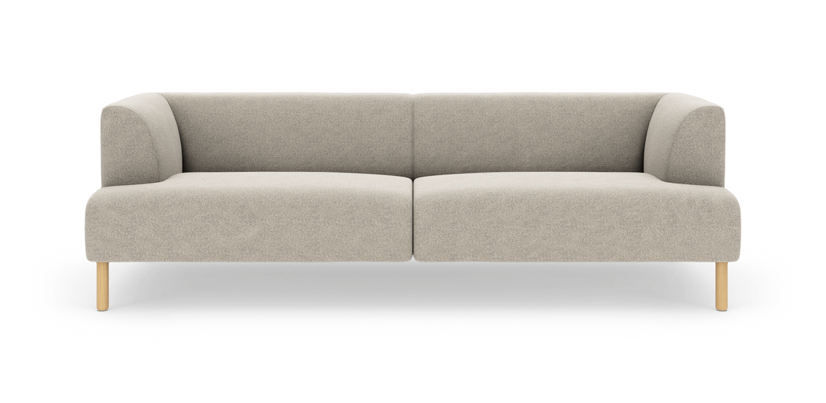 Beige modulsofa i stof med afrundede armlæn og lyse træben, frilagt på hvid baggrund.