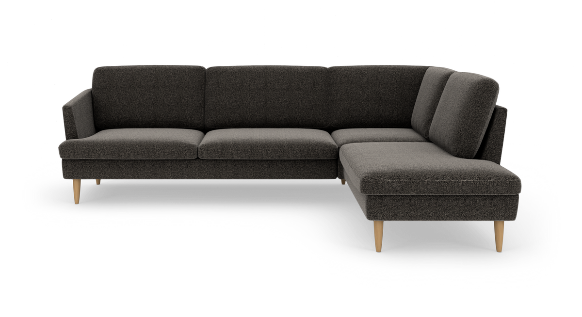 Mørkegrå L‑formet modulsofa med højre chaiselong og lyse træben.