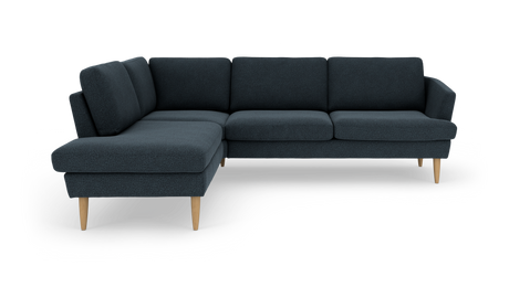 Mørkeblå L‑formet hjørnesofa med træben, fritlagt på hvid baggrund.