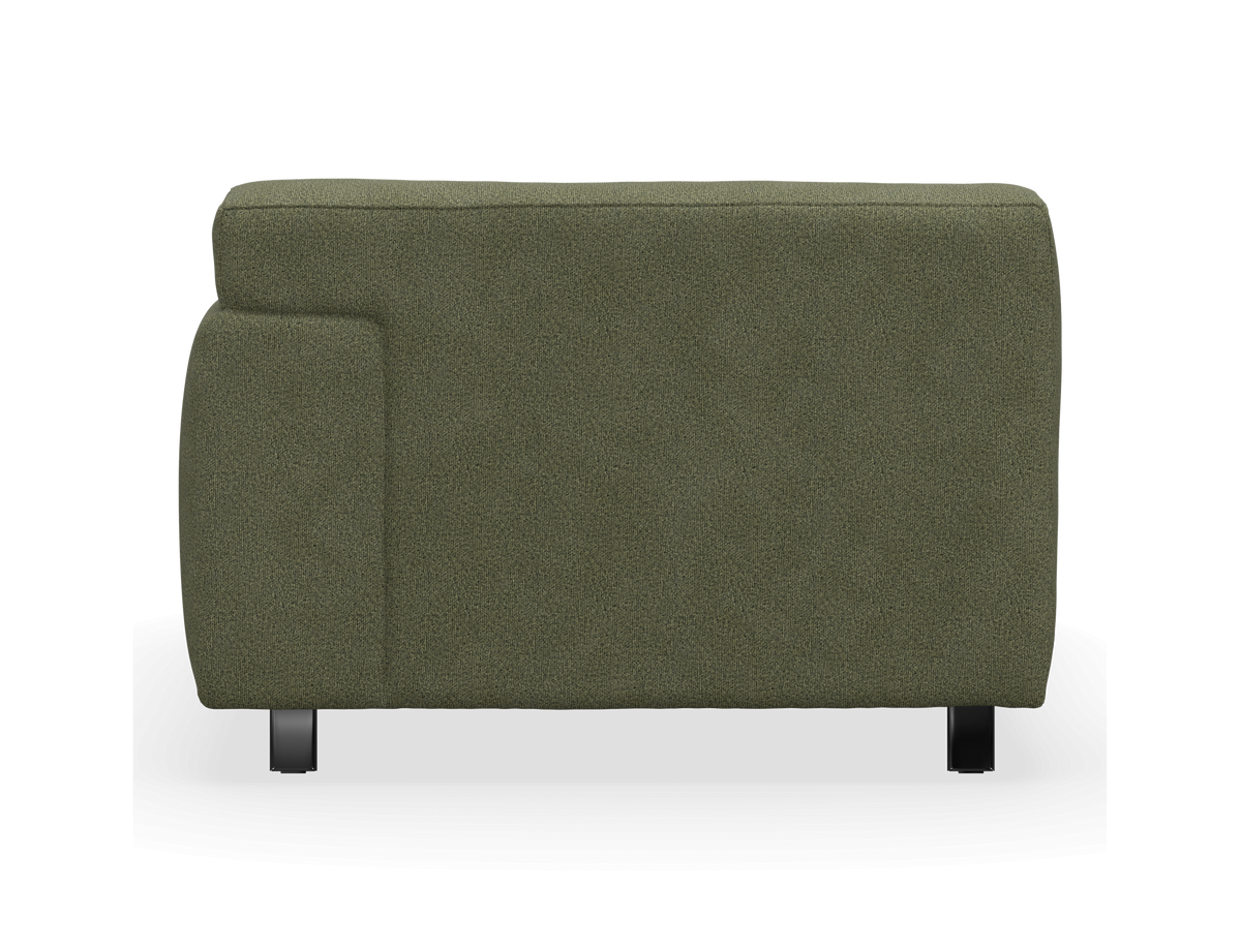Grøn modulsofa set fra siden, frilagt på hvid baggrund.