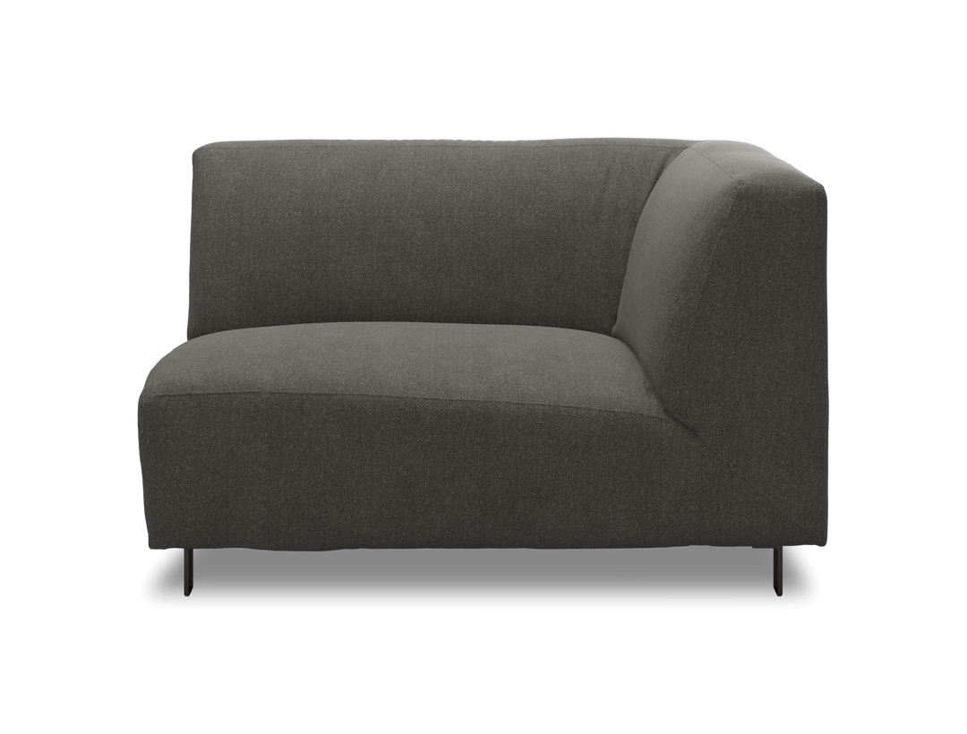Mørkegrå modulsofa, hjørnemodul med lav ryg og slanke ben.