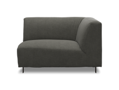 Mørkegrå modulsofa, hjørnemodul med lav ryg og slanke ben.