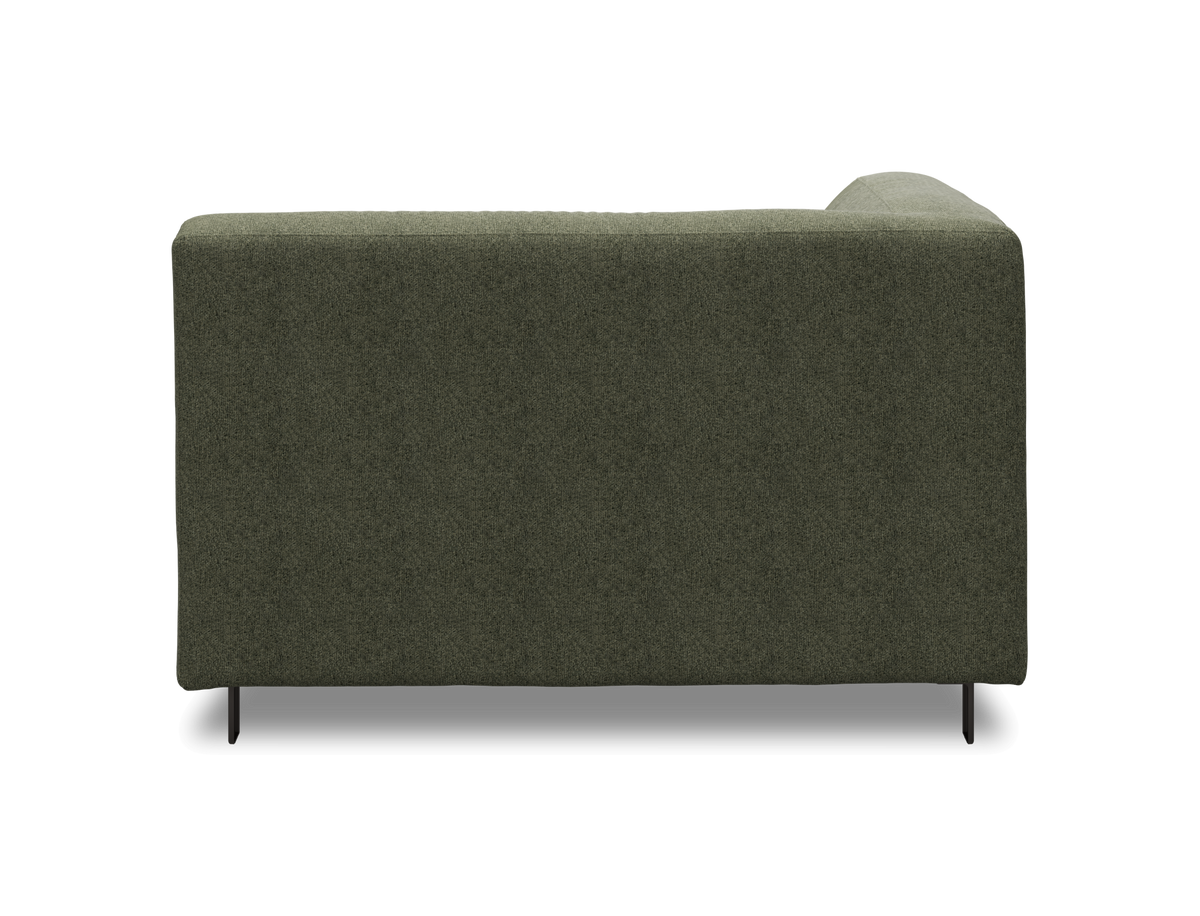 Grøn modulsofa set fra siden på hvid baggrund.