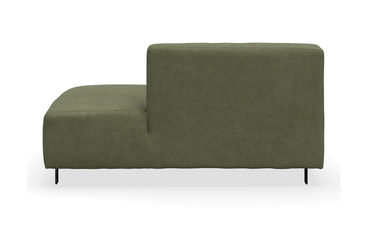 Grøn modulsofa i sidevisning med ryglæn til højre, frilagt.