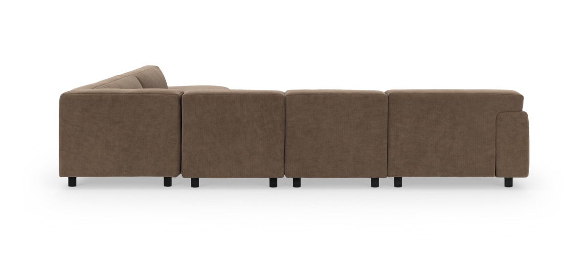 Brun modulsofa set bagfra, med armlæn i begge ender.