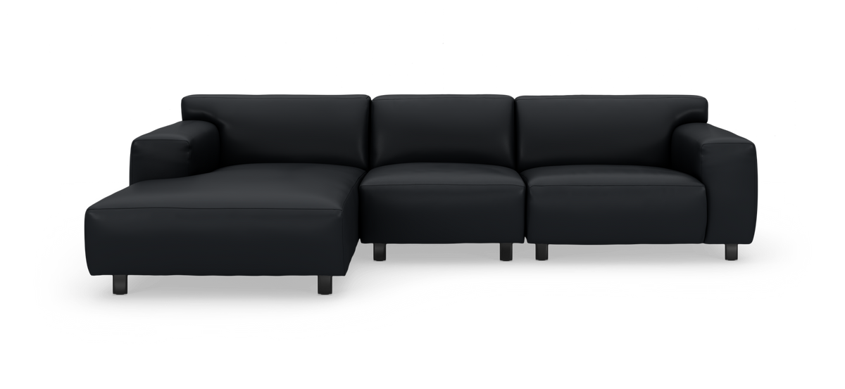Sort modulsofa med venstrevendt chaiselong, fritlagt på hvid baggrund.