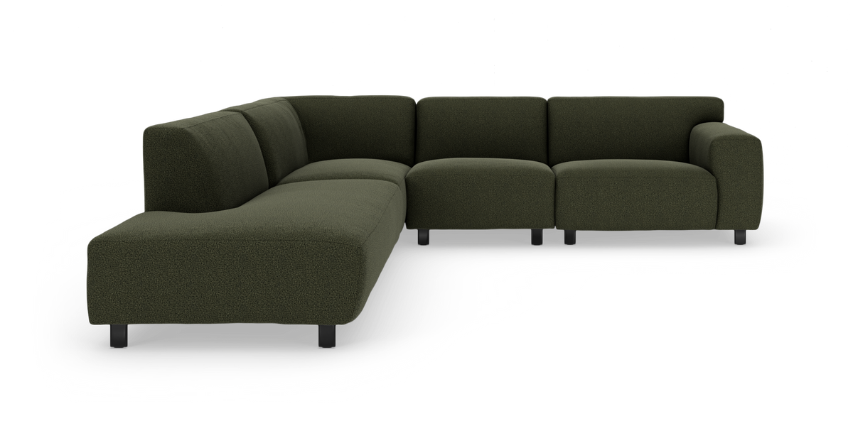 Mørkegrøn modul-hjørnesofa med bløde, afrundede former og sorte ben, frilagt på hvid baggrund.