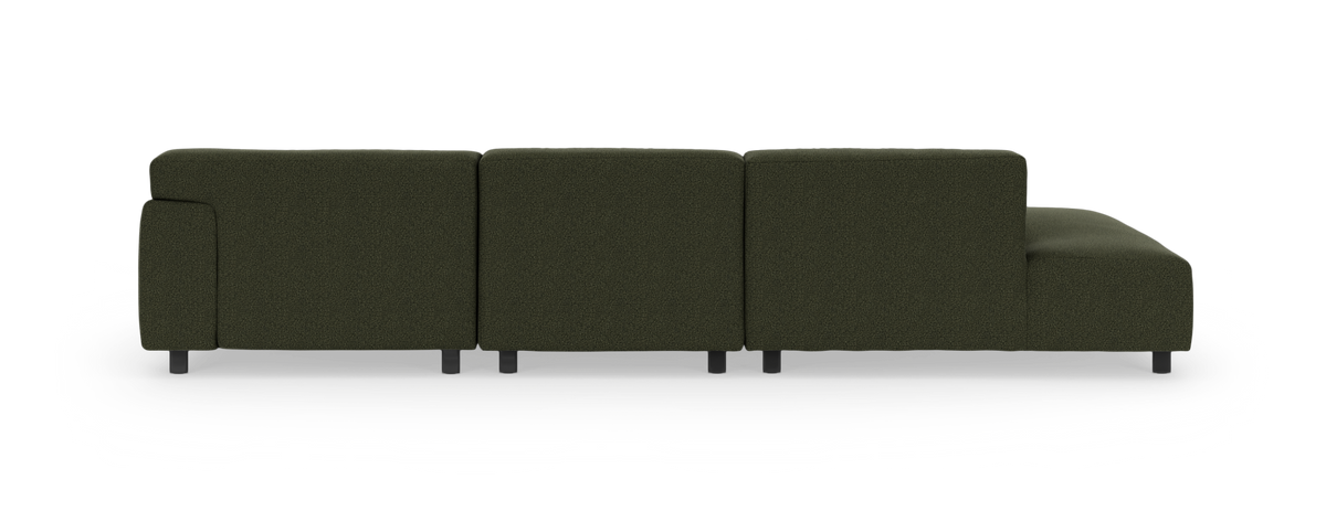 Mørkegrøn modulsofa med chaiselong til højre set bagfra.
