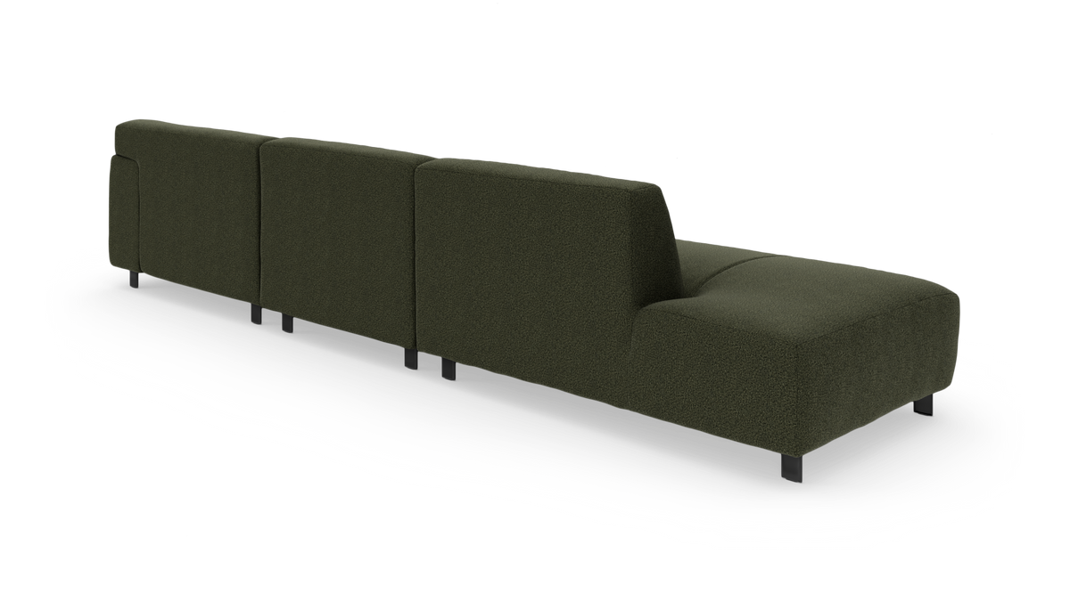 Mørkegrøn modulsofa set bagfra i studie på hvid baggrund.