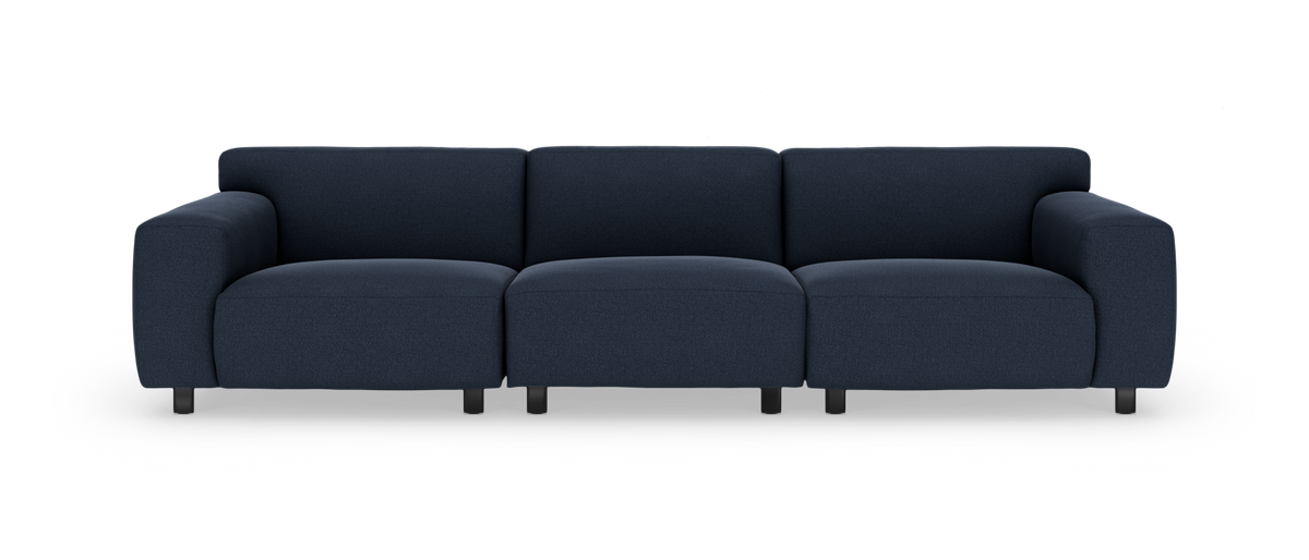 Mørkeblå firesædet sofa i moderne, blødt afrundet design, frontvisning.
