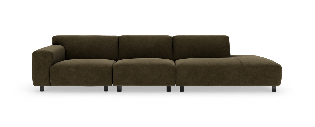 Modulsofa i mørk olivengrøn fløjl med venstre armlæn og chaiselong til højre, fritlagt på hvid baggrund.