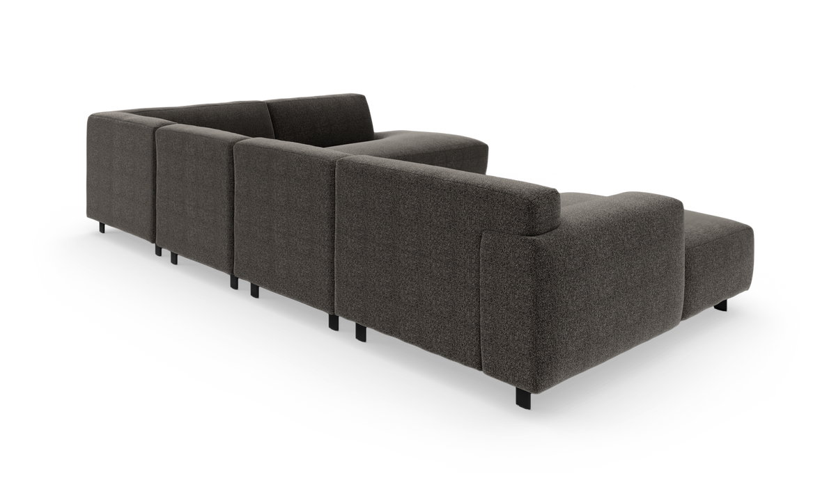 Modulsofa i mørkegråt tekstil, bagvinklet visning på hvid baggrund.