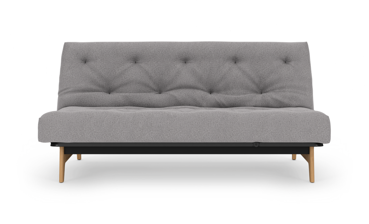 Grå tuftet 2‑personers sofa med træben på hvid baggrund