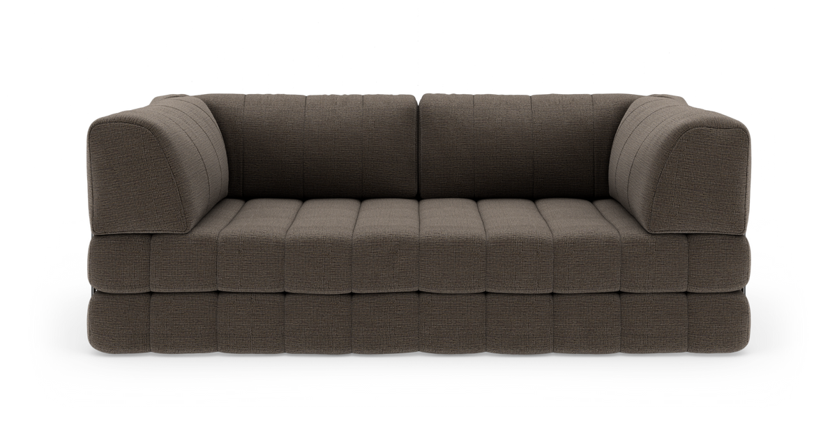 Mørkebrun modulsofa i stof på hvid studiobaggrund, set forfra.