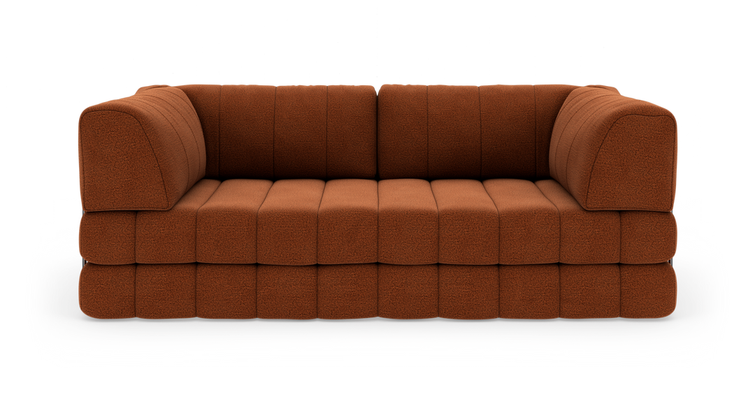 Rustbrun modulsofa i stof set direkte forfra, fritstående mod hvid baggrund.