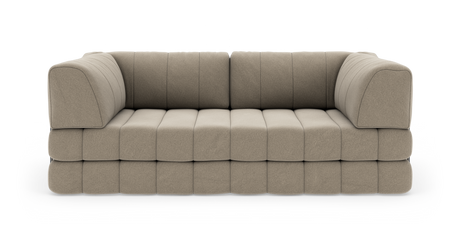 Beige modulsofa med blødt, quiltet sæde og afrundede armlæn, fritlagt på hvid baggrund.