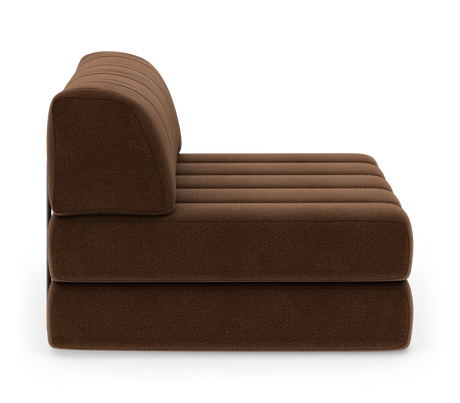 Brun modulsofa/loungesektion set fra siden på hvid baggrund.