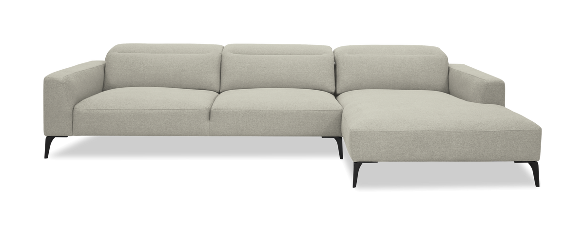 Lysegrå modulsofa med højre chaiselong på hvid baggrund.