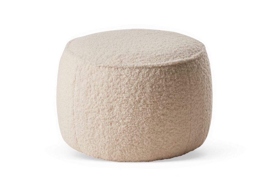 Beige rund bouclé‑puf/ottoman til sidde- eller fodskammel.