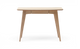 Lyst skrivebord/konsolbord i eg med koniske ben og smal midtskuffe, fritlagt mod hvid baggrund, frontvisning.