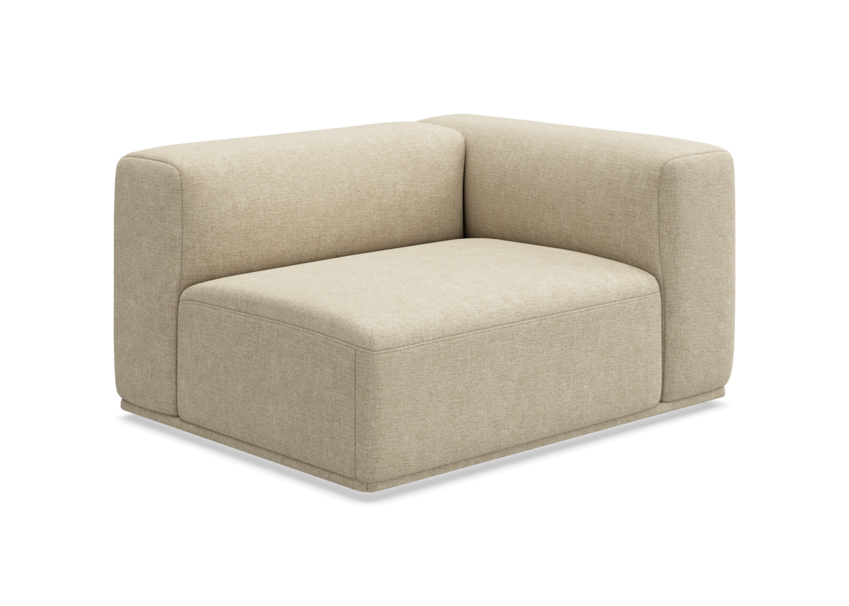 Beige modulsofa, hjørnemodul med bløde, afrundede former.