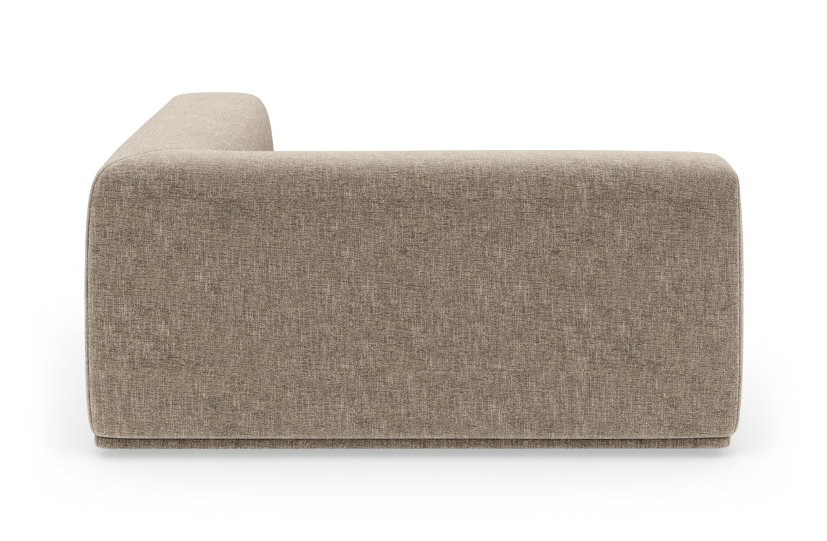Beigefarvet modulsofa set fra siden på hvid baggrund.