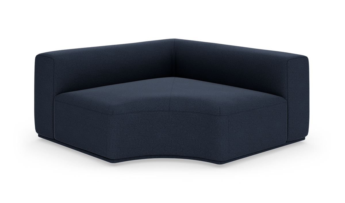 Mørkeblå hjørnemodul til sofa i tekstil, frilagt på hvid baggrund.